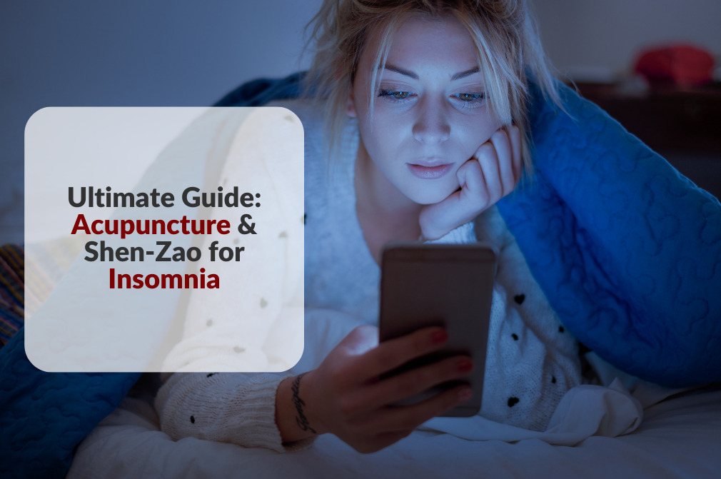Woman under covers in bed reading phone with superimposed article title "Ultimate Guide: Acupuncture & Shen-Zao for Insomnia"