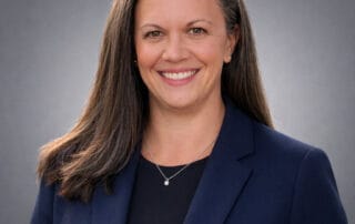 Headshot of Dr. Michelle Winton, Acupuncturist and RMT at Red Leaf Wellness Edmonton