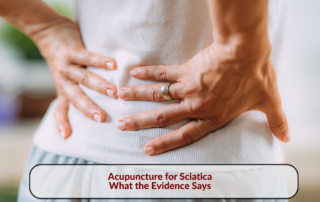Person holding their lower back, with the title Acupuncture for Sciatica: What the Evidence Says.