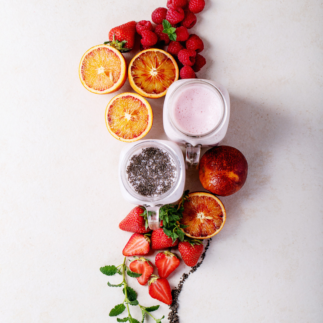 Overhead view of a variety of fruits, yogurt, and herbs, symbolizing the holistic approach of the Jumpstart program at Red Leaf Wellness in Edmonton.