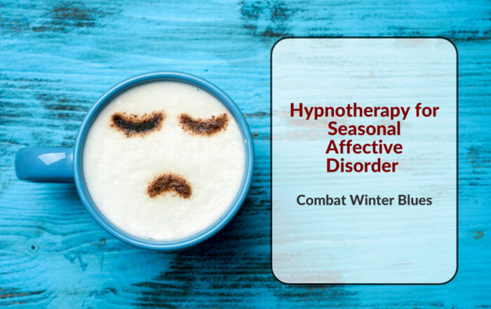 Blue mug with a latte art depicting a sad face, next to a white card displaying the text 'Hypnotherapy for Seasonal Affective Disorder - Combat Winter Blues' against a rustic blue wooden background.