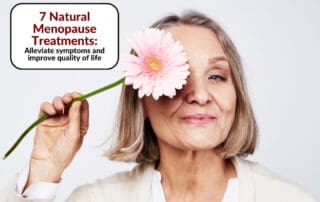 A smiling older woman holding a pink flower over one eye - Red Leaf Wellness Edmonton