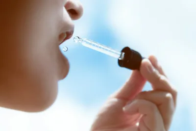 photo - a woman taking homeopathic remedies for uti