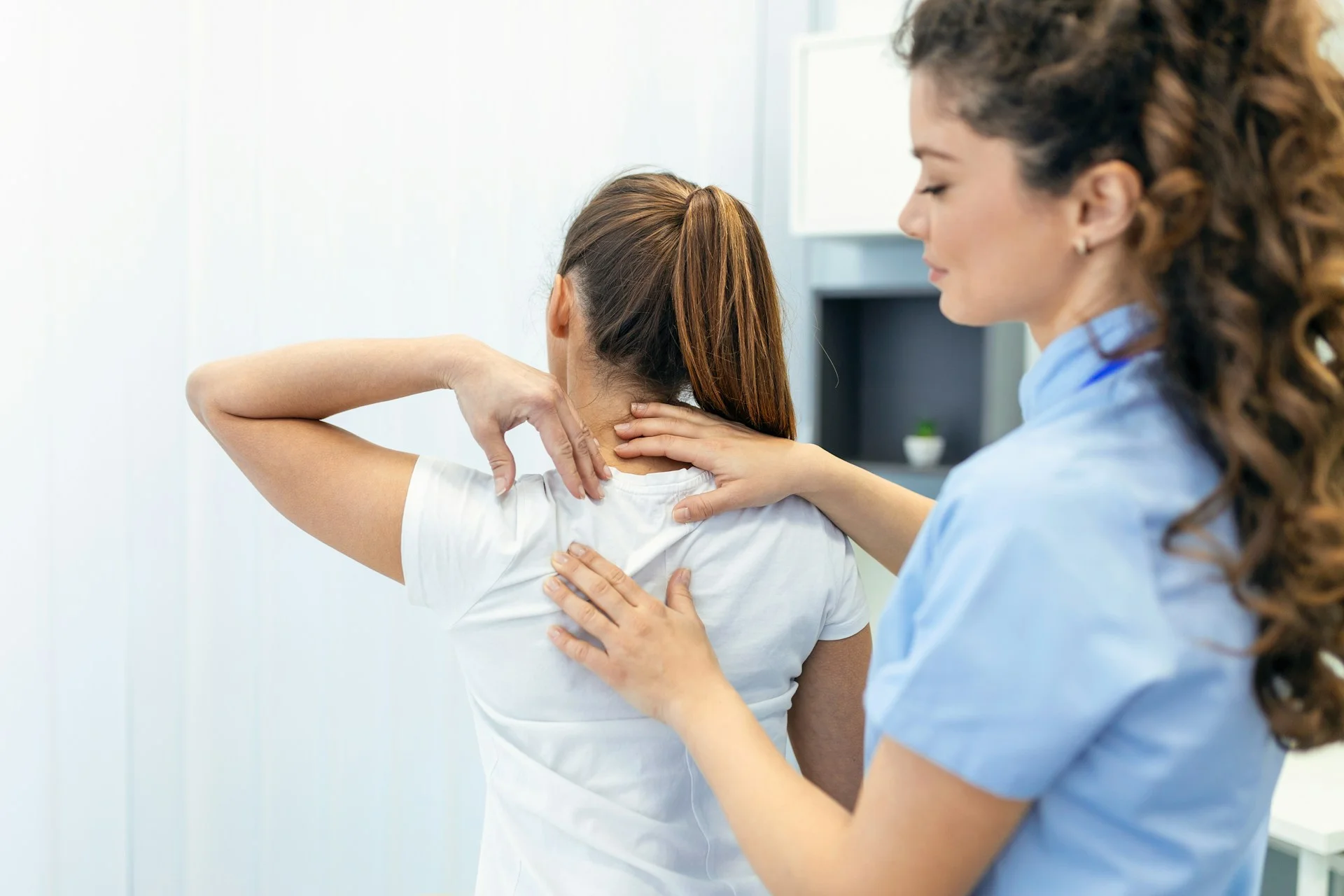 photo - a patient and a massage therapist on a prenatal massage edmonton session