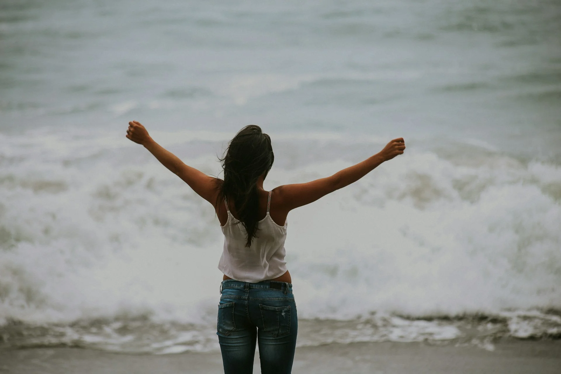 photo - a woman by the sea enjoying the effects of supplements for adrenal fatigue 