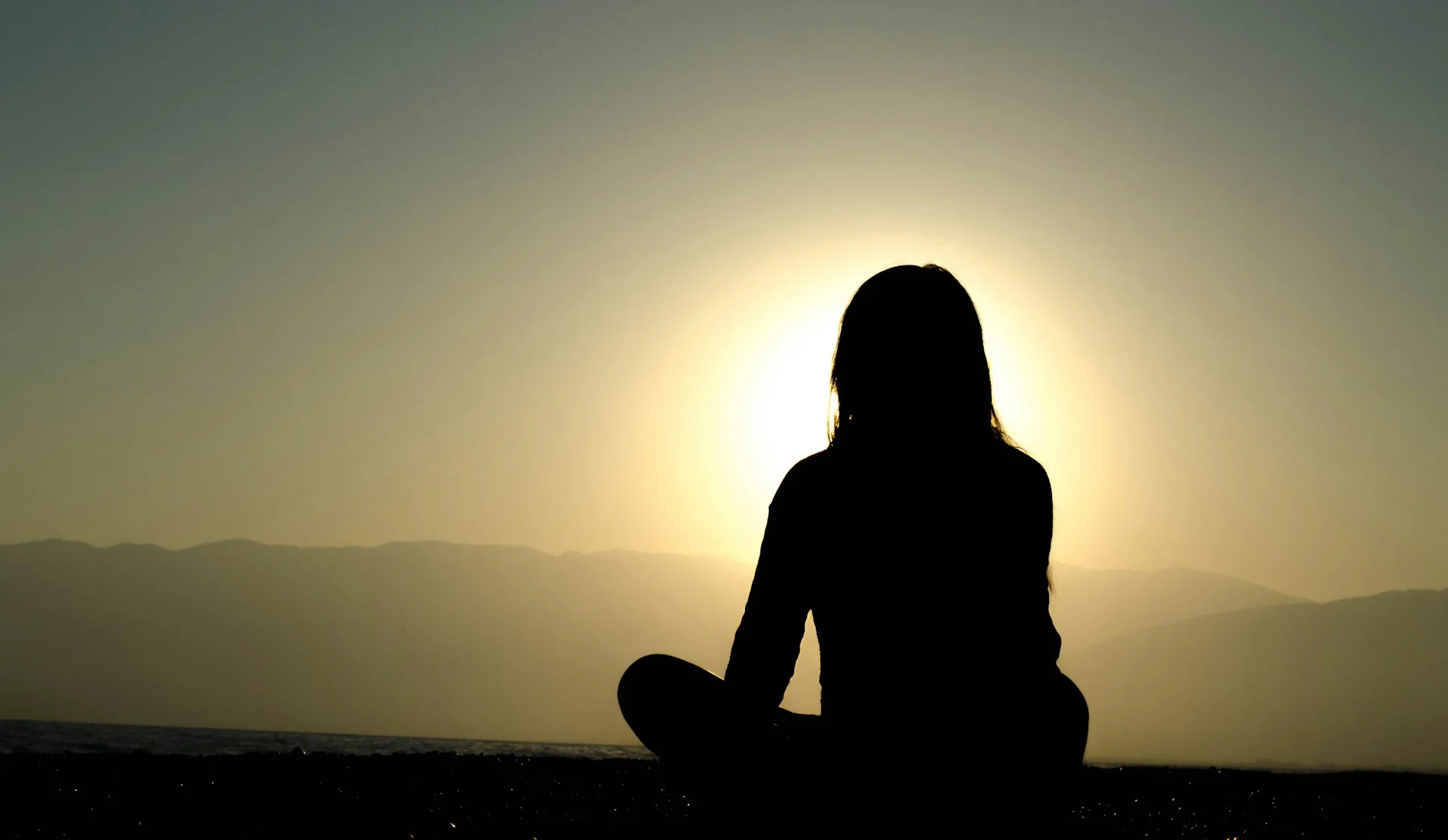 photo- a woman looking at the sun rising thankful for managing pcos naturally