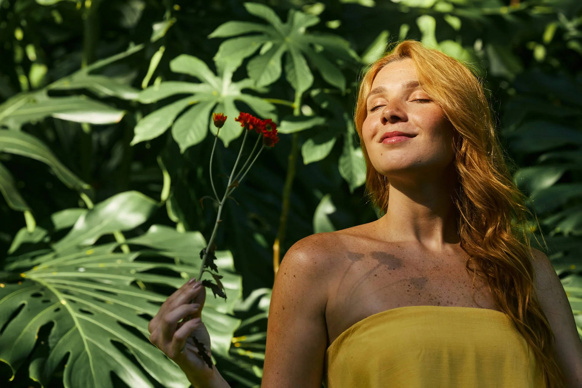 photo - a woman enjoying sunshine in the garden after managing PCOS naturally