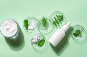 Natural ingredients like herbs, cream, and a dropper bottle on a green background, symbolizing natural approaches for managing PCOS.