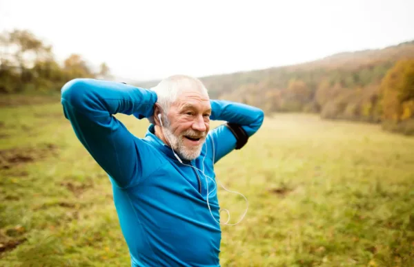 a man on a run in a park after taking probiotics for men