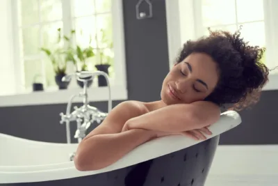 photo - a woman in bathtub soothing her uti flare up 