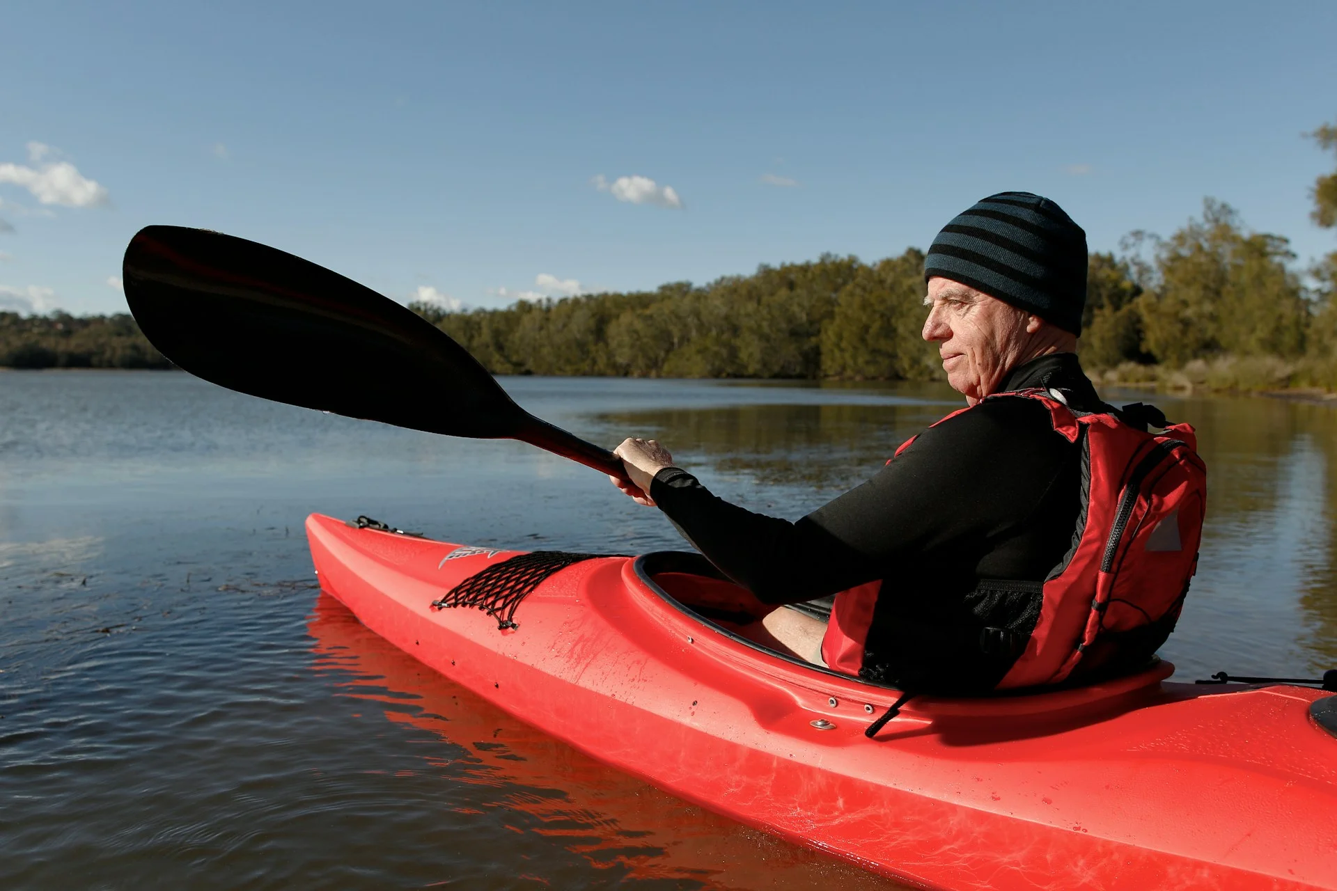 a man kayaking after successful trt canada treatment