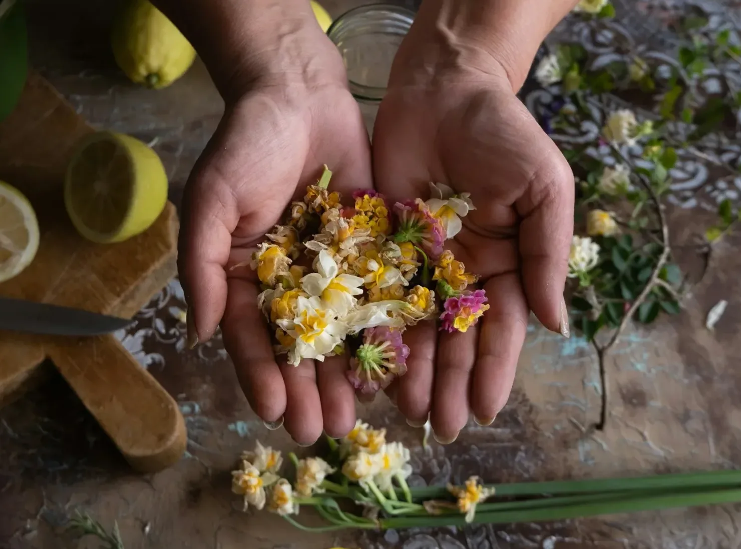 a naturopathic doctor edmonton holding up healing flowersheal