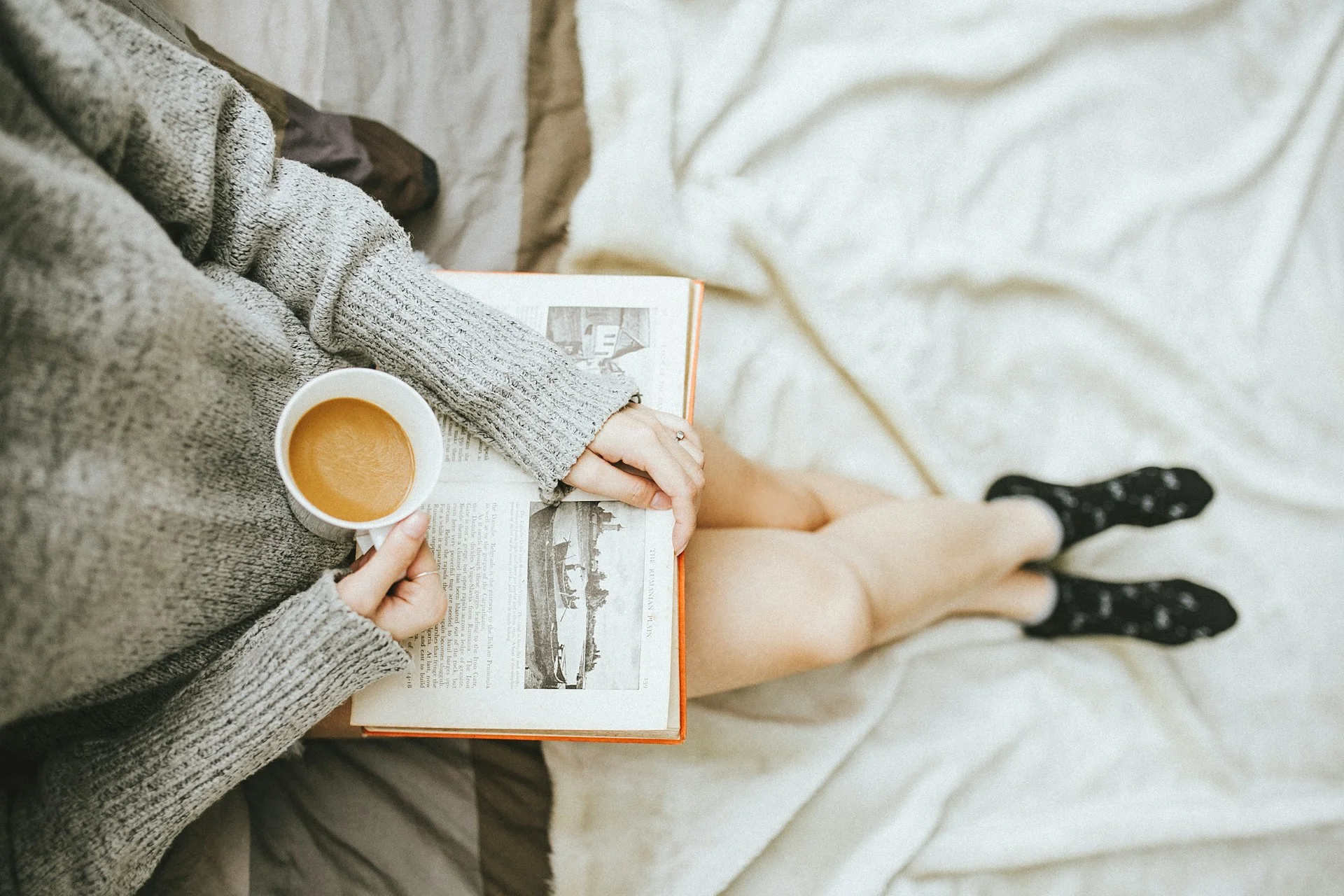 photo a woman reading a book after her acupuncture sessoin