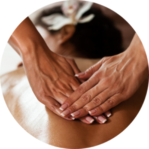 Therapist's hands performing Swedish massage on a client's back with a relaxing spa ambiance.