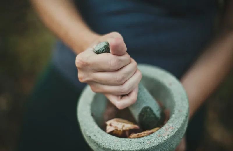 a woman preparing herbal tinctures canada