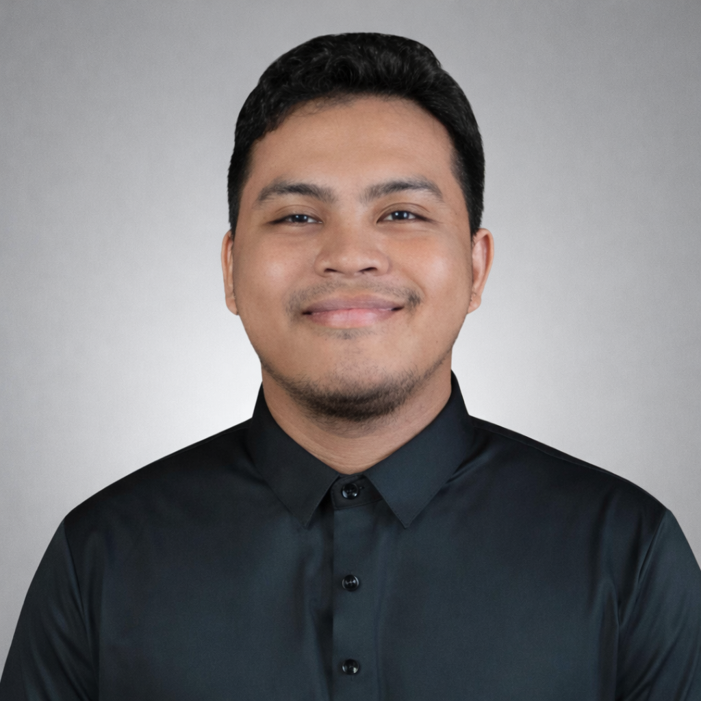 A professional headshot of Francis Gabotero, Virtual Assistant at Red Leaf Wellness, smiling in a dark collared shirt against a light gray background.