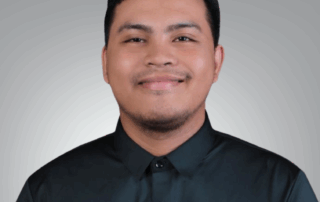 A professional headshot of Francis Gabotero, Virtual Assistant at Red Leaf Wellness, smiling in a dark collared shirt against a light gray background.