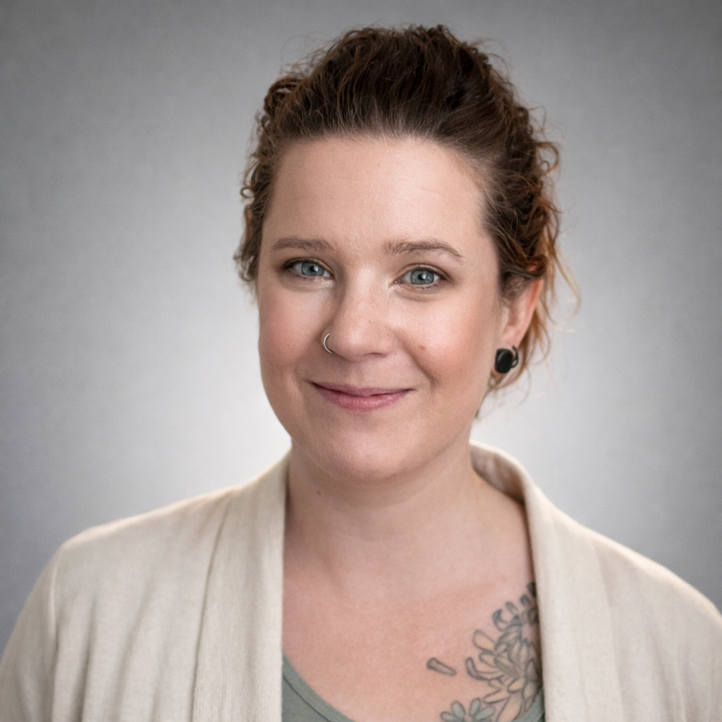 Portrait of Lia Crotenko, patient care coordinator, wearing a light colored jacket and smiling at the camera