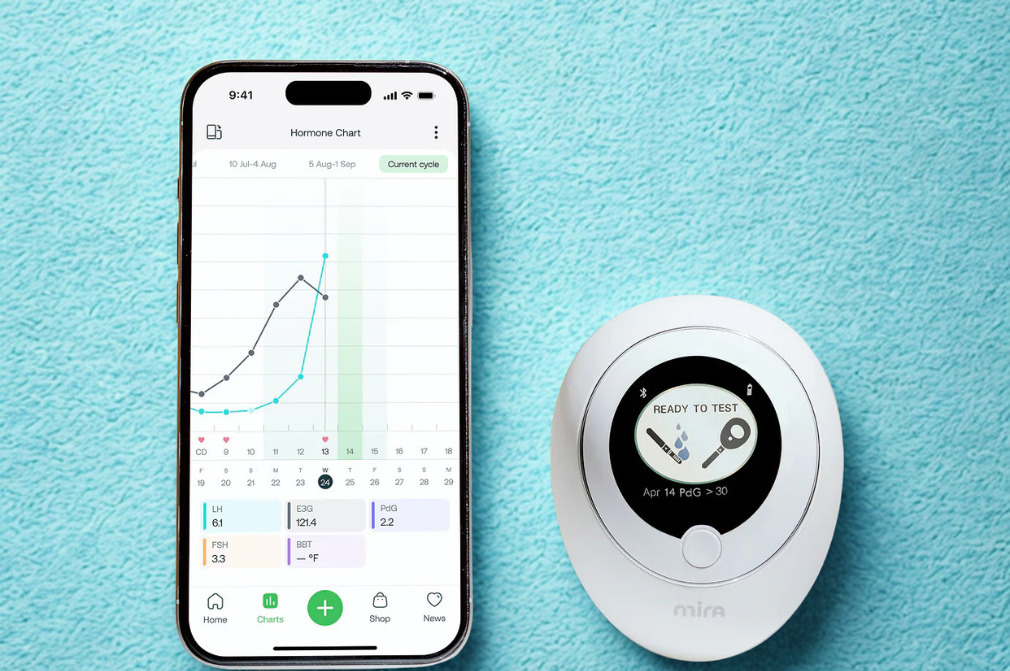 Mira at-home fertility hormone monitor device and smartphone app displaying LH, E3G, PdG and FSH hormone chart readings, recommended by Red Leaf Wellness Edmonton